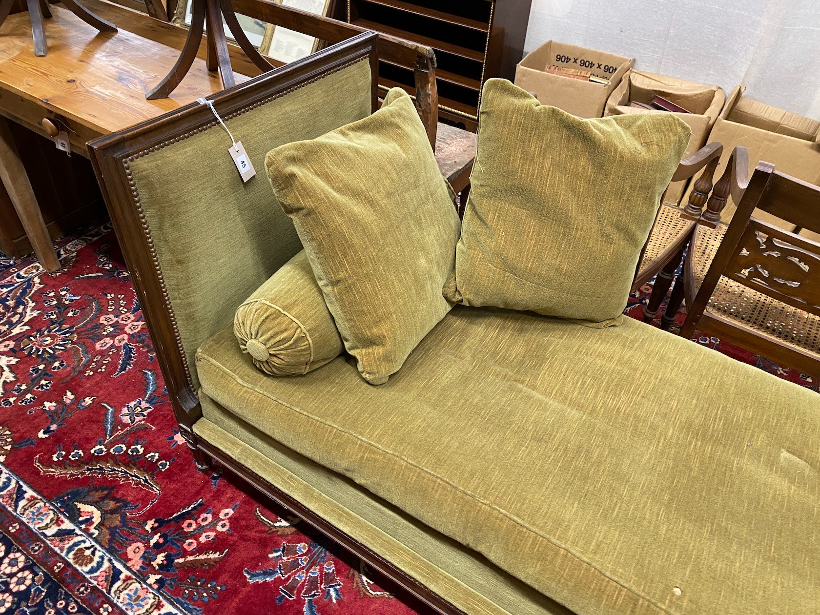 An early 20th century French upholstered mahogany day bed, length 184cm, depth 76cm, height 90cm